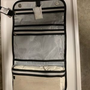 Brand new with tags from smoke free home. Tahari travel cosmetic bag.
